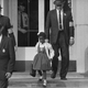 U.S. Deputy Marshals escort six-year-old Ruby Bridges from William Frantz Elementary School in New Orleans, La., in Nov. 1960. The first grader is the only black child enrolled in the school, where parents of white students are boycotting the court-ordered integration law and are taking their children out of school. Photo via AP Images.